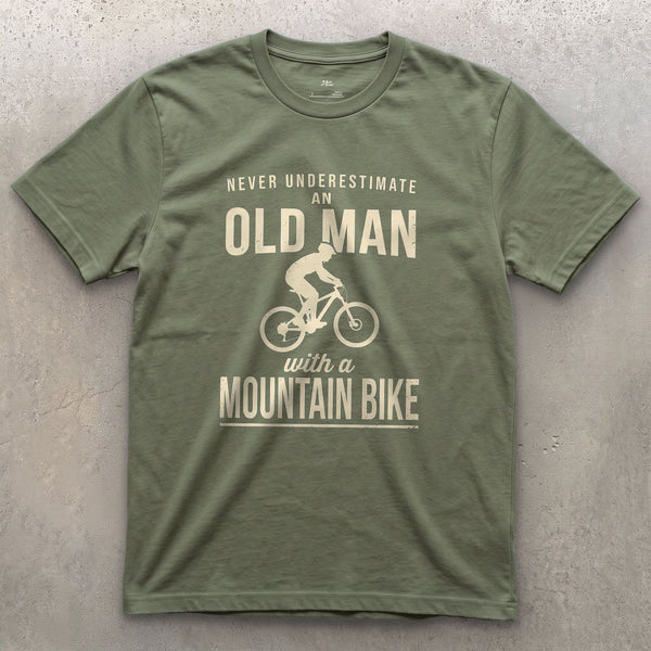 Never Underestimate an Old Man With a Mountain Bike design on a Military Green Gildan Softstyle t-shirt