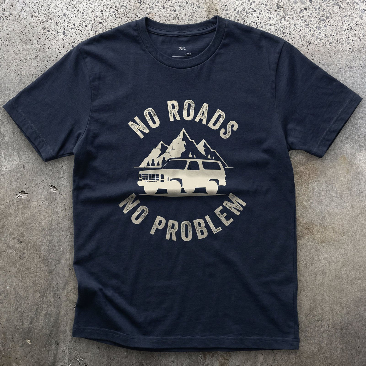 No Roads, No Problem, Peaks Behind the Wagon design on a Navy Gildan Softstyle t-shirt