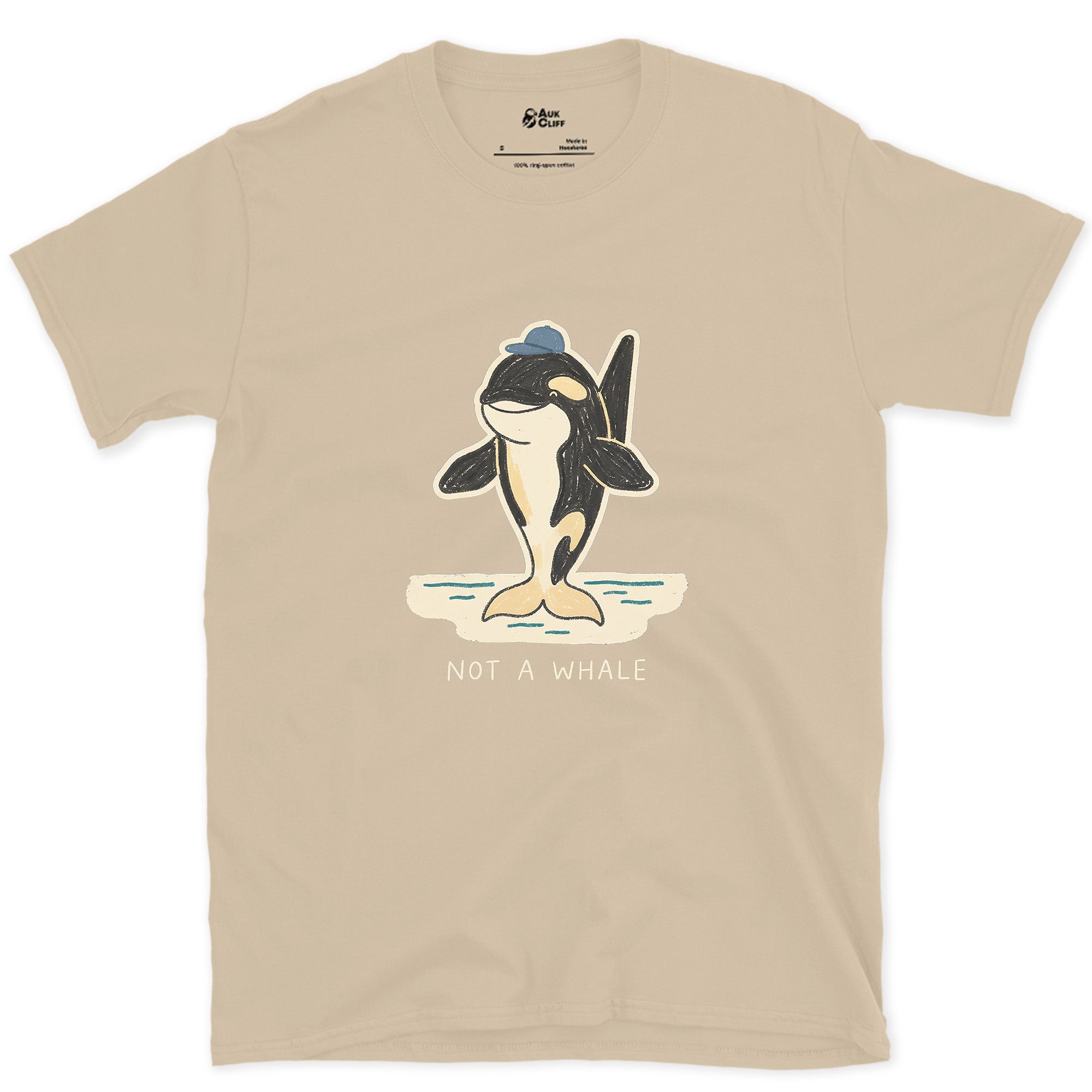 Not a Whale, Orca in a Cap design on a Sand Gildan Softstyle t-shirt