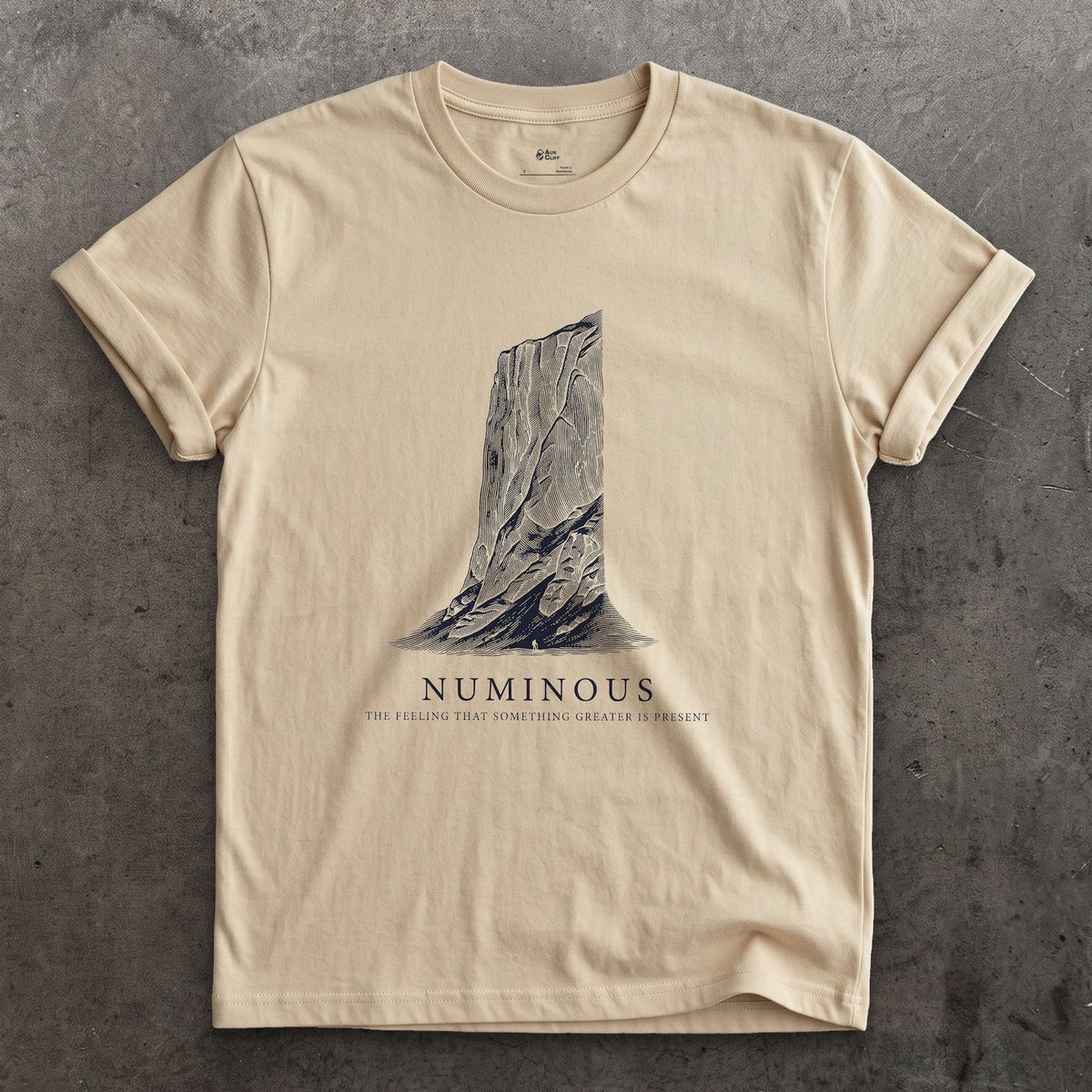 Numinous, the Feeling That Something Greater is Present design on a Sand Gildan Softstyle t-shirt