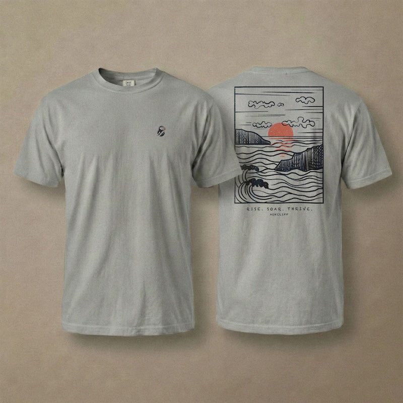 AukCliff Ocean Sunset Waves tee in Grey, hand-drawn sunset and waves line art across the back