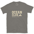 The Ocean Club, Small Wave Badge design on a Charcoal Gildan Softstyle t-shirt