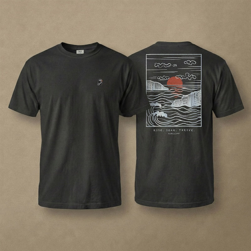 AukCliff Ocean Sunset Waves tee in Black, hand-drawn sunset and waves line art across the back