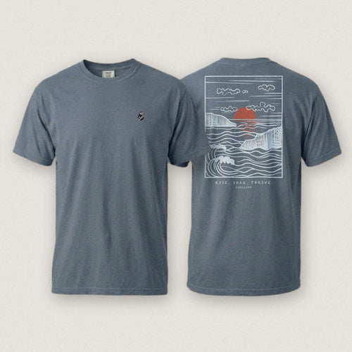 AukCliff Ocean Sunset Waves tee in Blue Jean, sunset and waves line art across the back