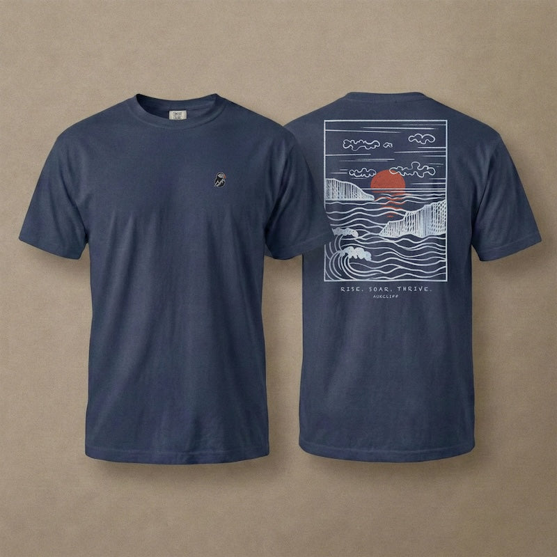 AukCliff Ocean Sunset Waves tee in True Navy, hand-drawn sunset and waves line art across the back