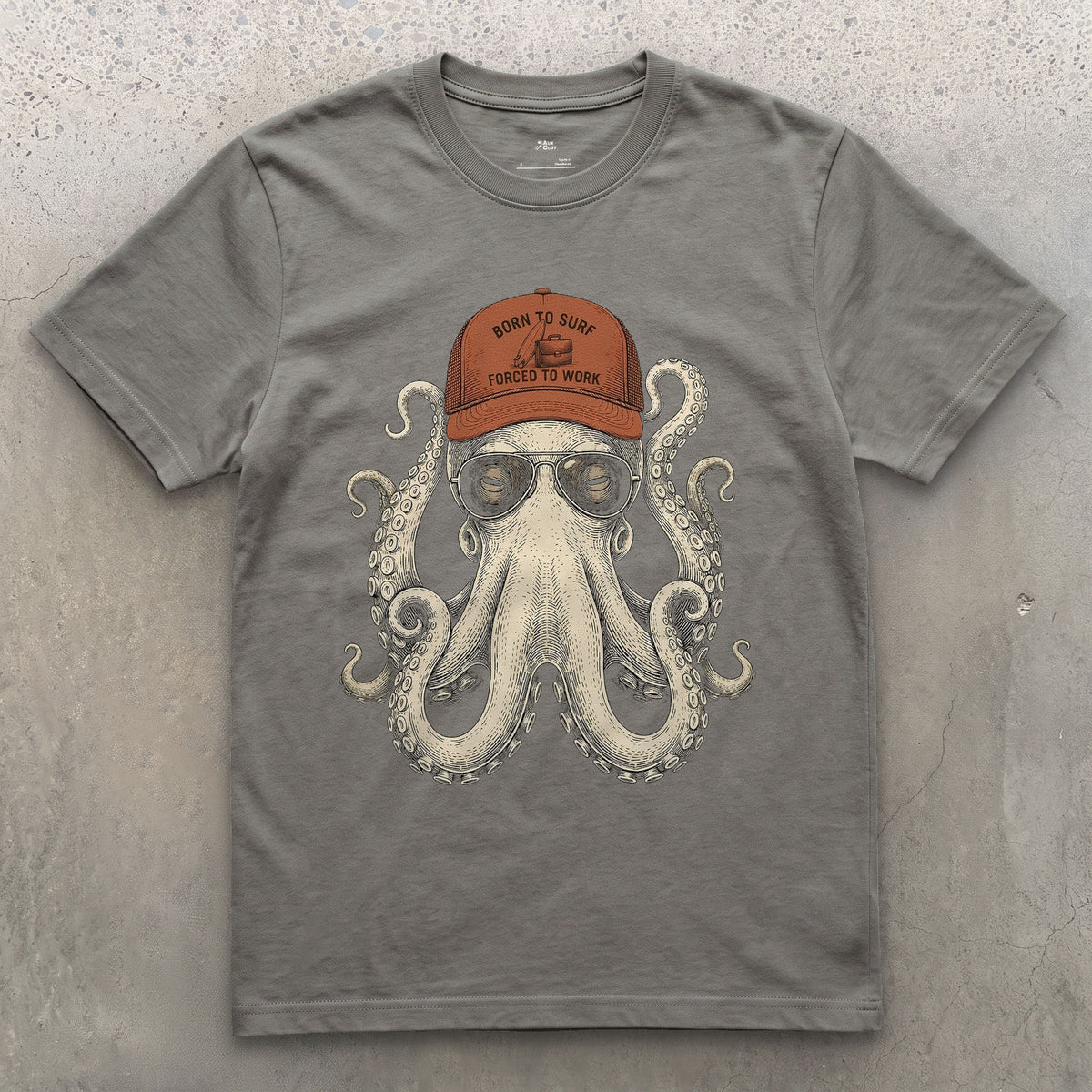Born to Surf, Octopus in a Trucker Cap design on a Charcoal Gildan Softstyle t-shirt