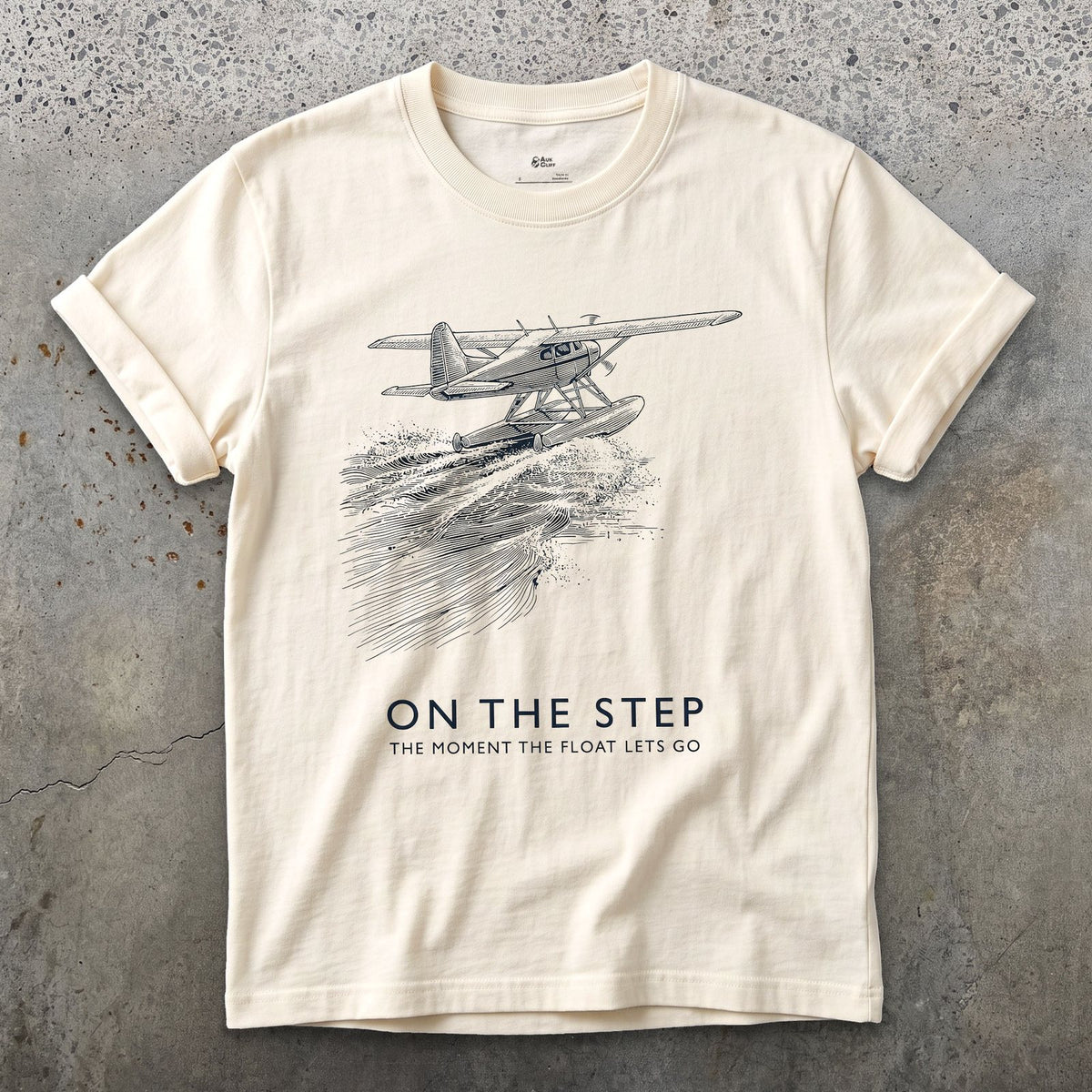 On the Step, the Float Lets Go design on a Natural Gildan Softstyle t-shirt