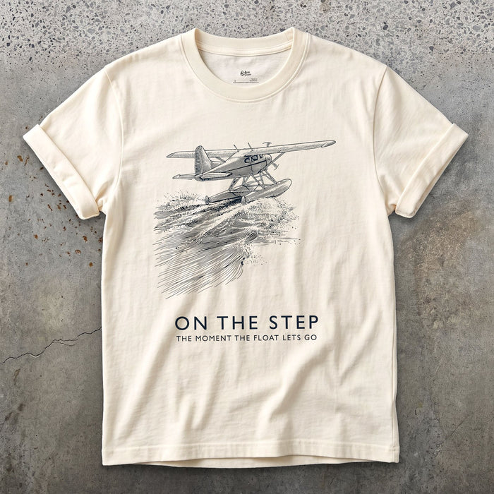 On the Step, the Float Lets Go design on a Natural Gildan Softstyle t-shirt
