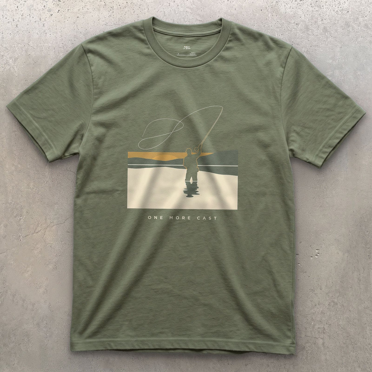 One More Cast, Angler at Sunset design on a Military Green Gildan Softstyle t-shirt