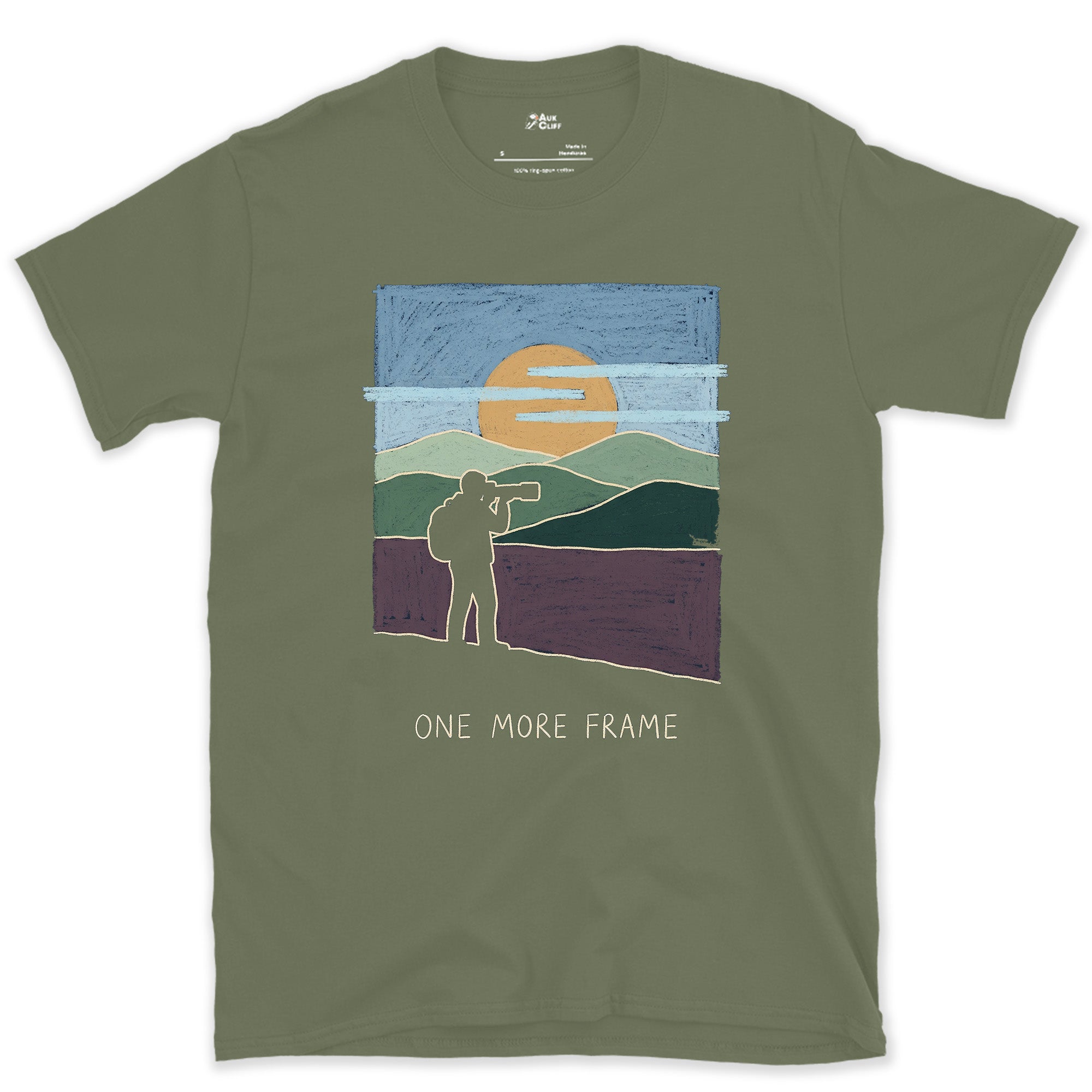 One More Frame, Photographer on the Hillside design on a Military Green Gildan Softstyle t-shirt