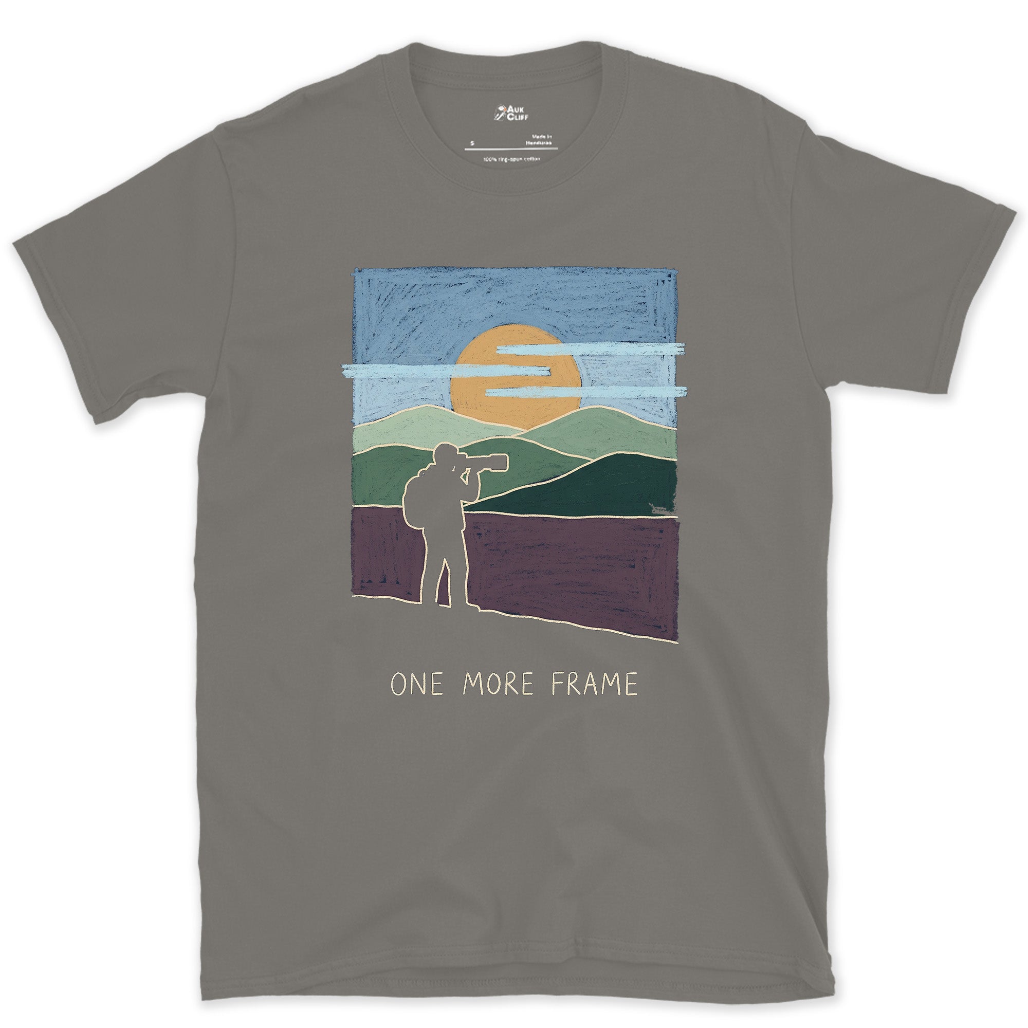 One More Frame, Photographer on the Hillside design on a Charcoal Gildan Softstyle t-shirt