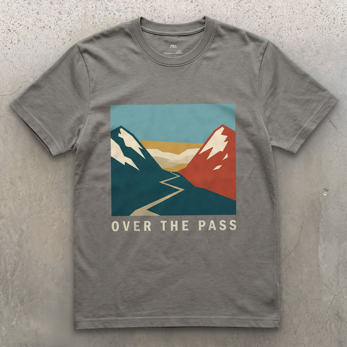 Over the Pass, Red Peaks and Blue design on a Charcoal Gildan Softstyle t-shirt