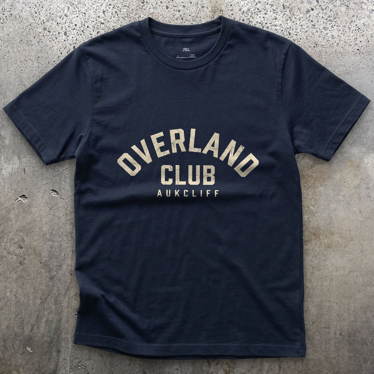 Overland Club Arch Badge design on a Navy Gildan Softstyle t-shirt