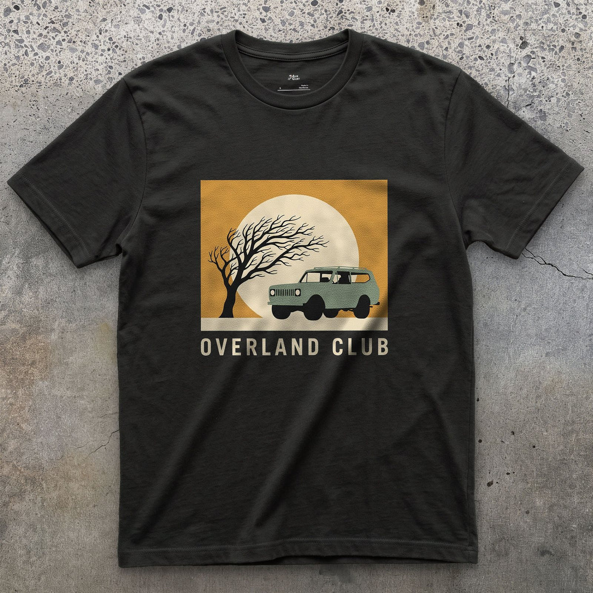 Overland Club, Bare Tree Under a Full Moon design on a Black Gildan Softstyle t-shirt