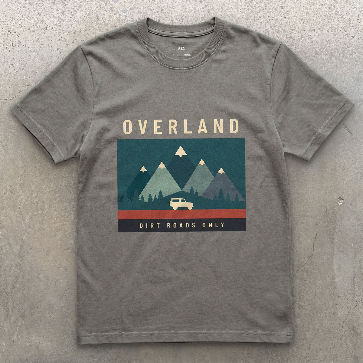 Dirt Roads Only, Small Wagon Between the Peaks design on a Charcoal Gildan Softstyle t-shirt