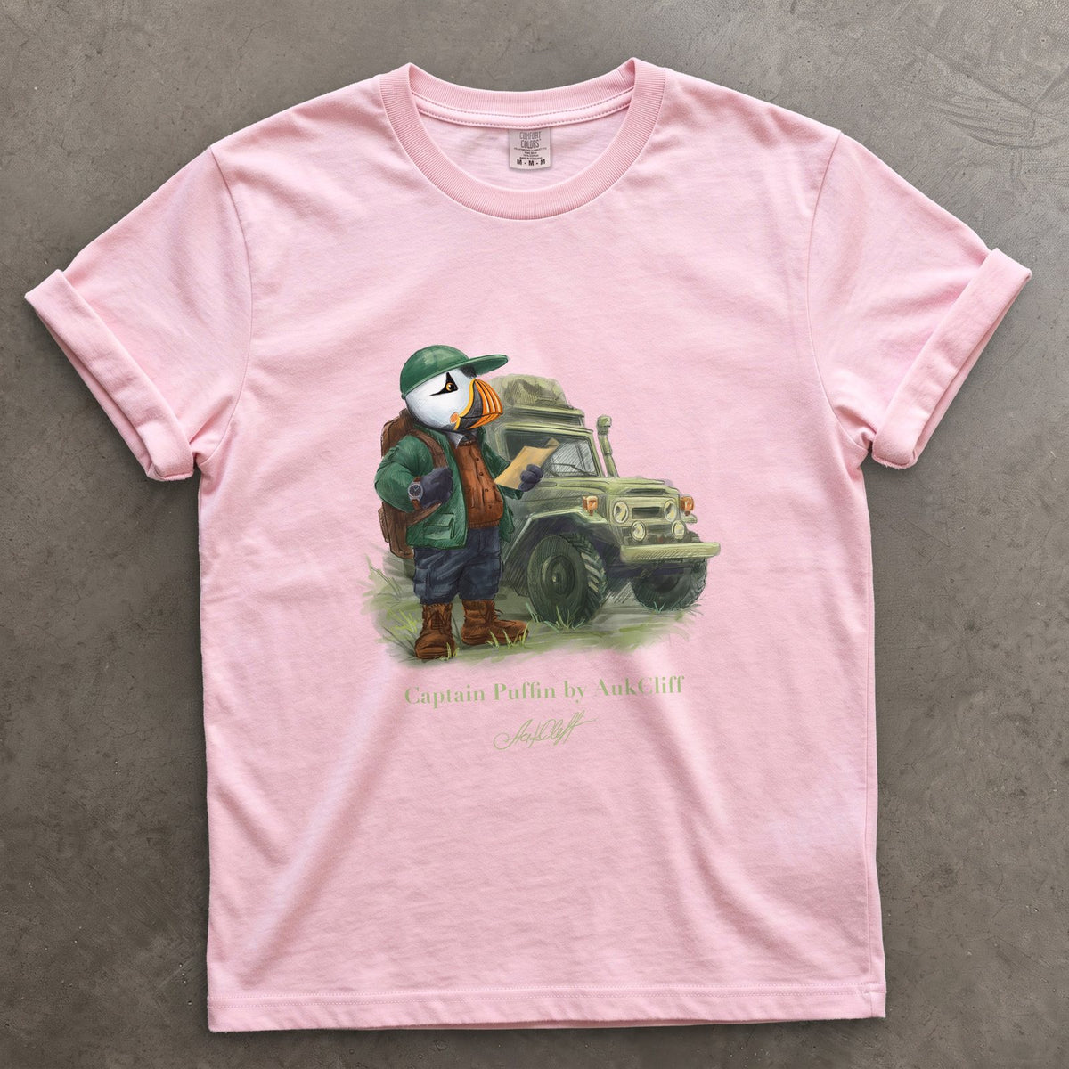 Captain Puffin Overland Explorer on a Blossom Comfort Colors t-shirt