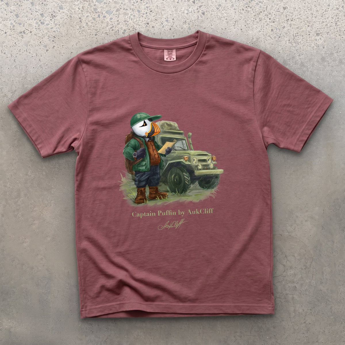 Captain Puffin Overland Explorer on a Brick Comfort Colors t-shirt