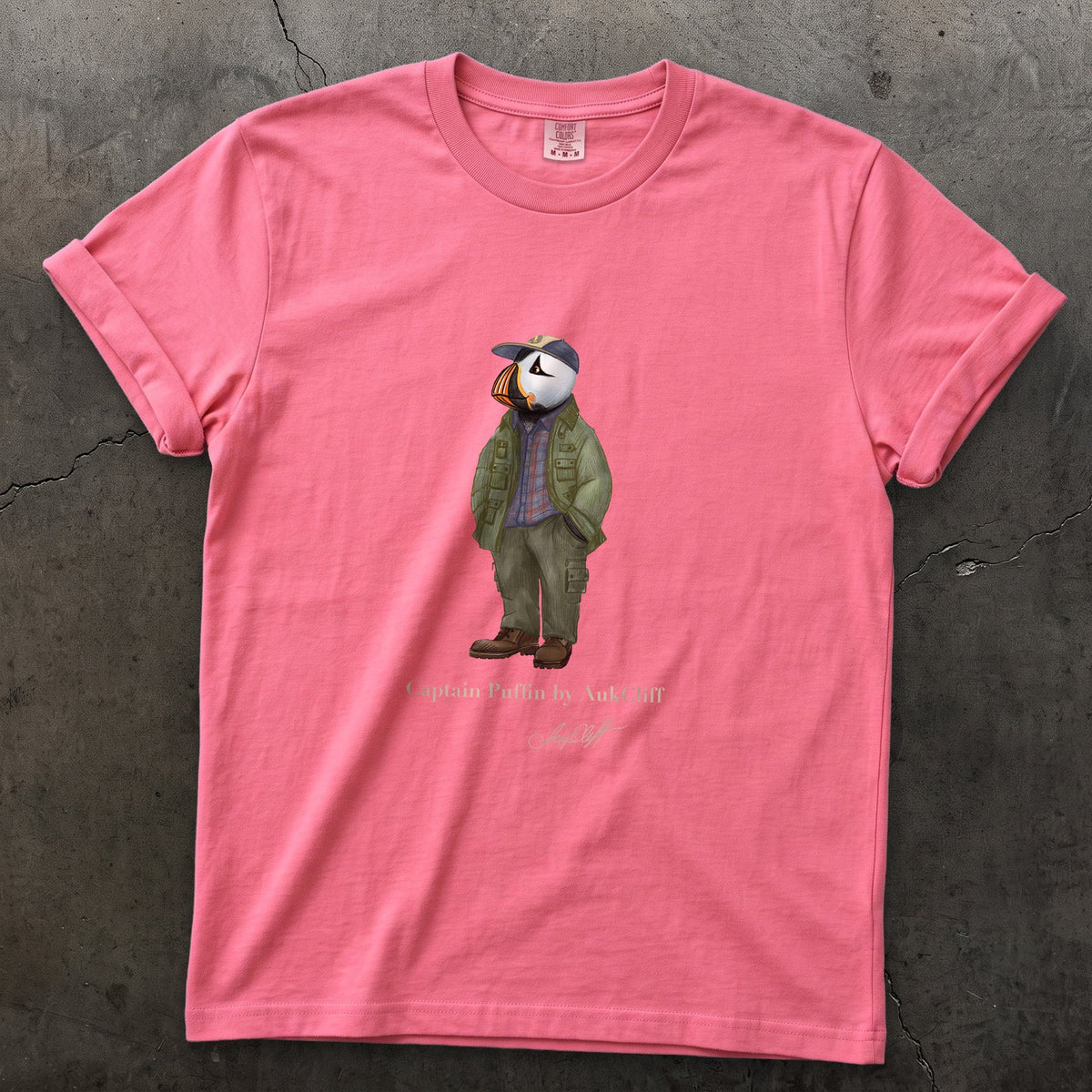 Captain Puffin Pacific Northwest Trailkeeper on a Crunchberry Comfort Colors t-shirt