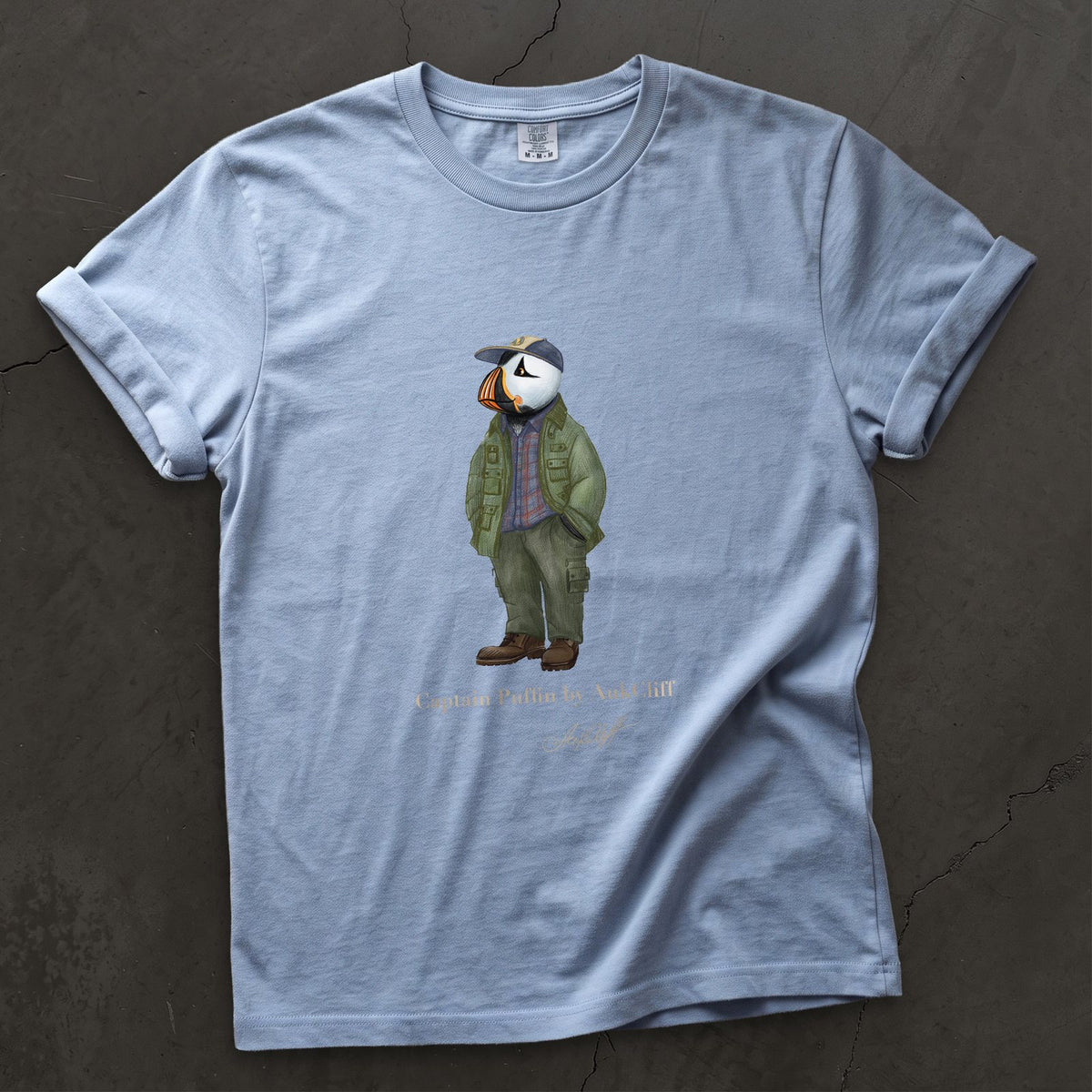 Captain Puffin Pacific Northwest Trailkeeper on a Washed Denim Comfort Colors t-shirt