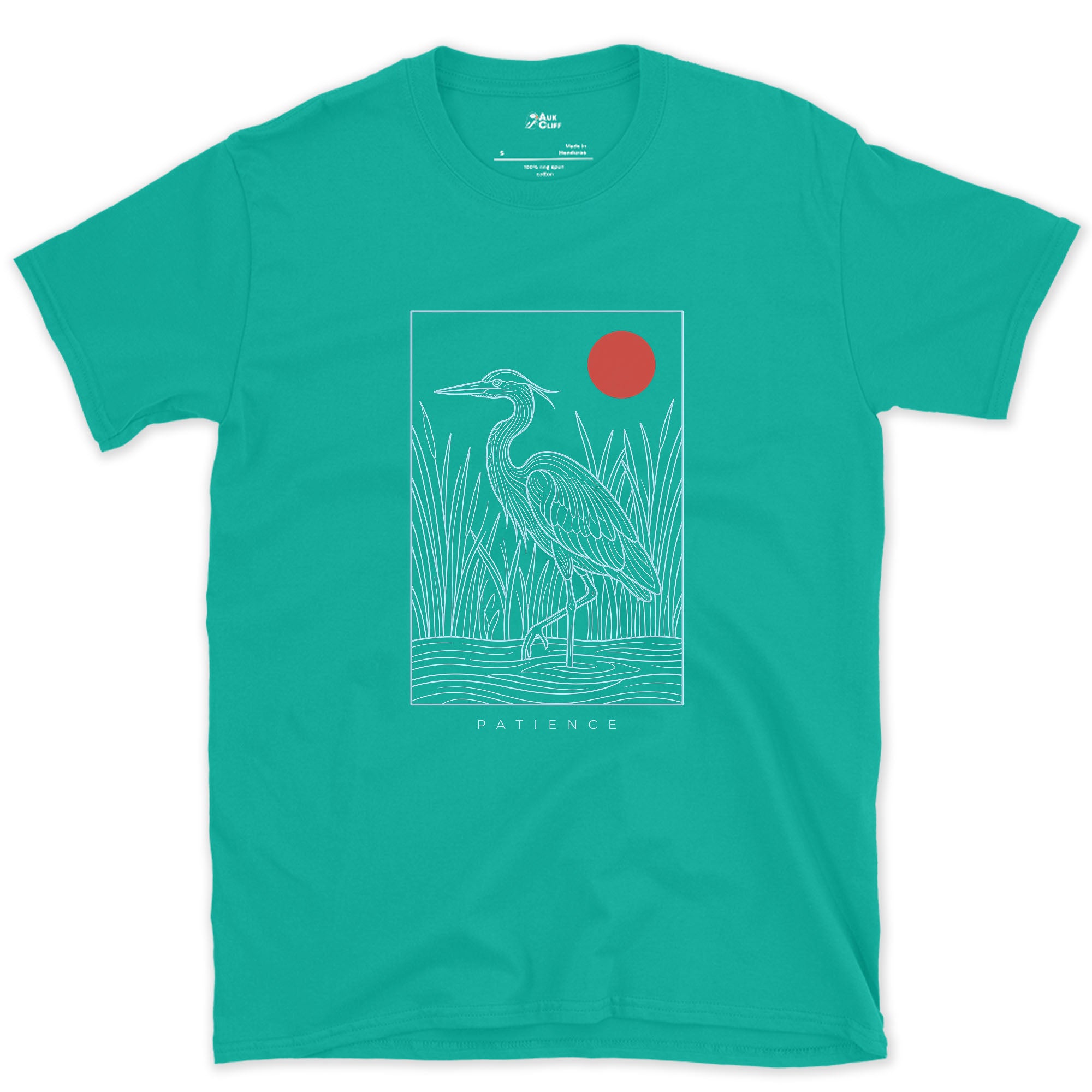 Patience, Heron in the Reeds Under a Red Sun design on a Jade Dome Gildan Softstyle t-shirt