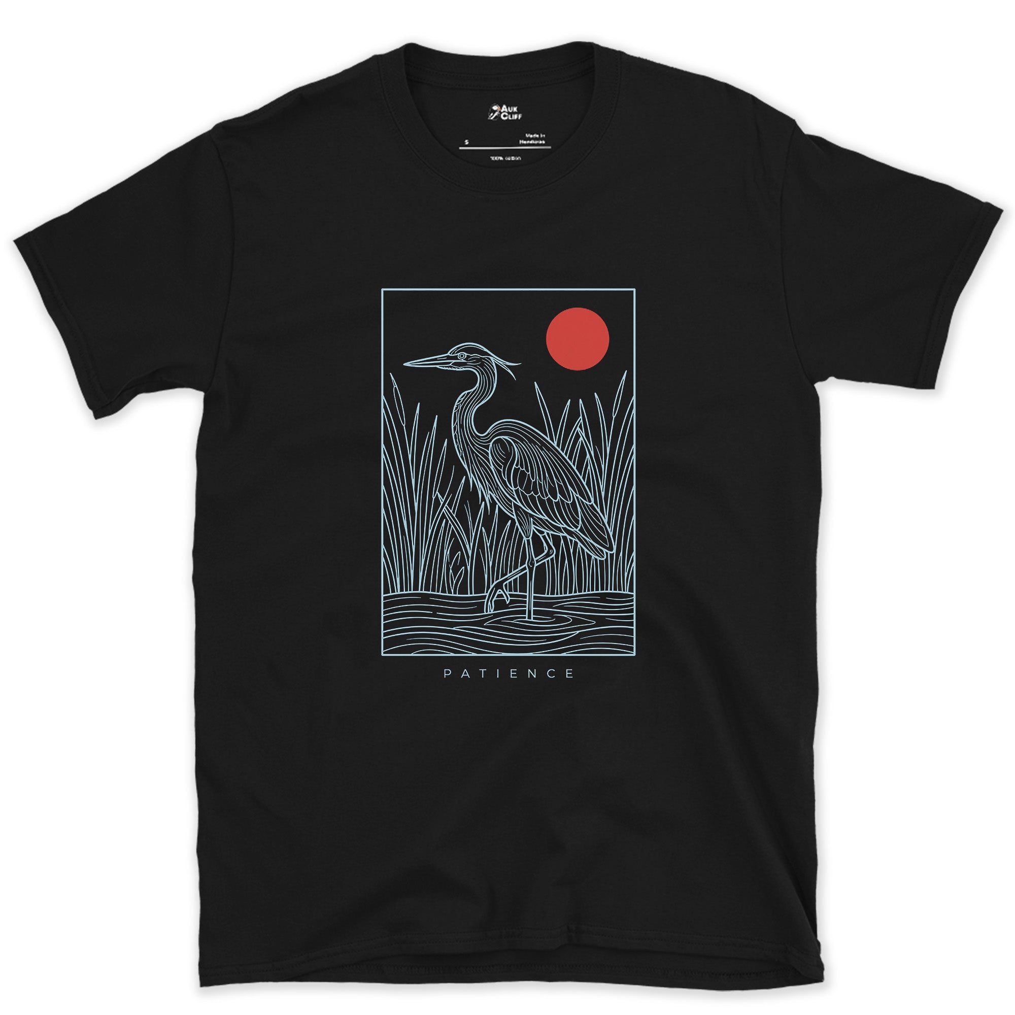 Patience, Heron in the Reeds Under a Red Sun design on a Black Gildan Softstyle t-shirt