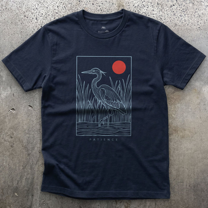 Patience, Heron in the Reeds Under a Red Sun design on a Navy Gildan Softstyle t-shirt