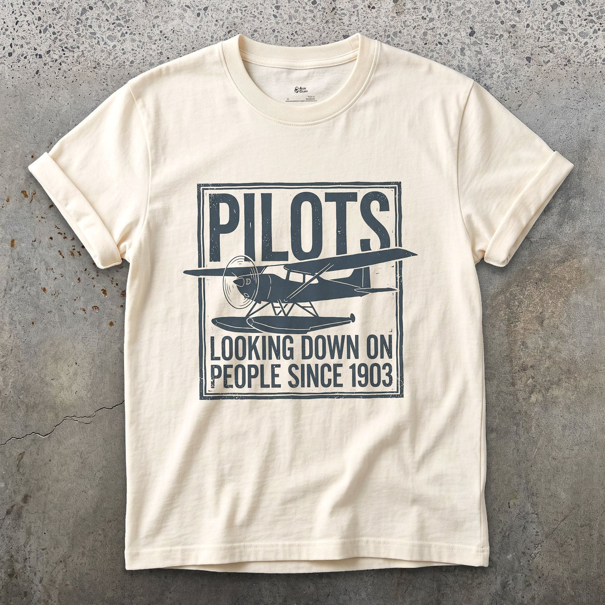 Pilots Looking Down Since 1903 design on a Natural Gildan Softstyle t-shirt