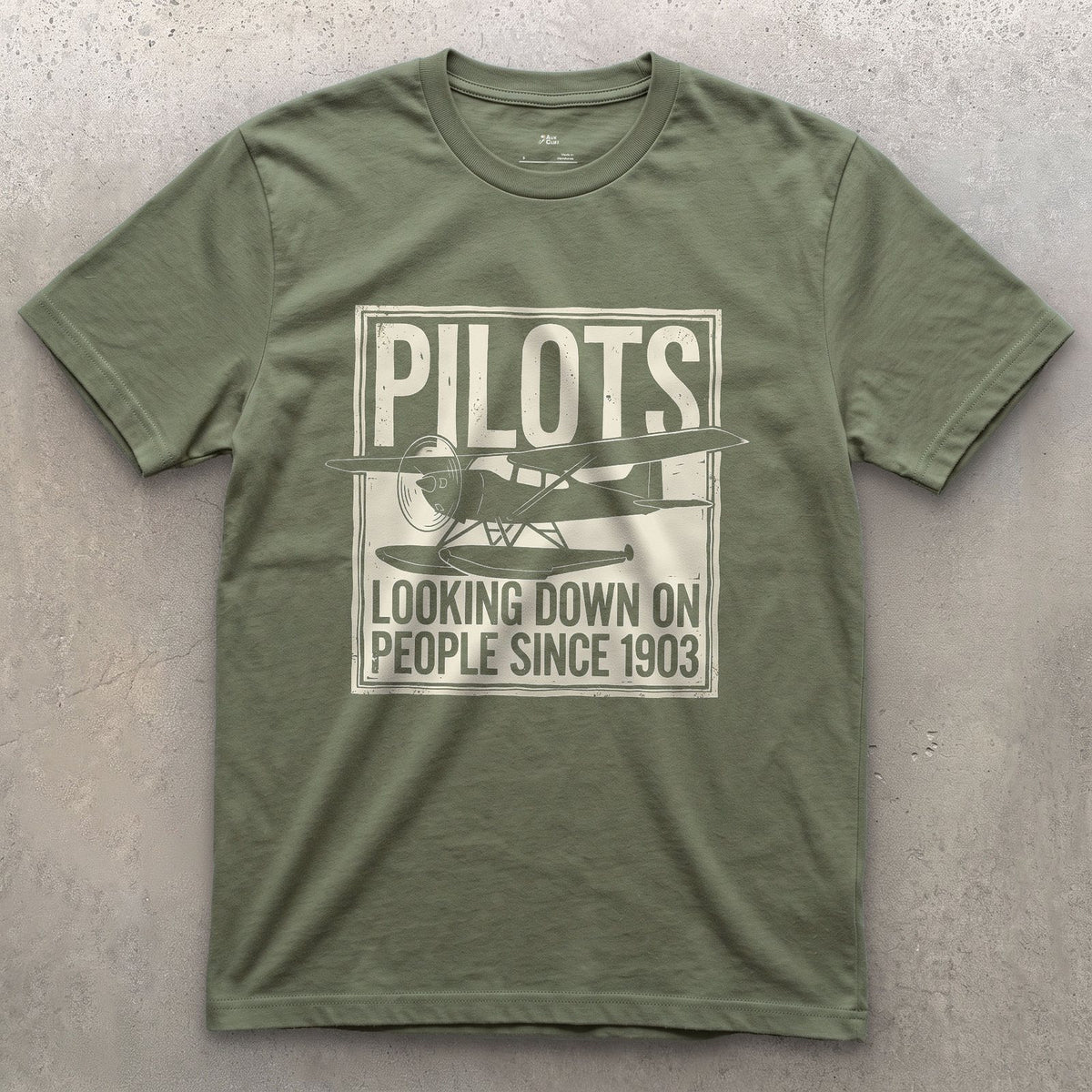 Pilots Looking Down Since 1903 design on a Military Green Gildan Softstyle t-shirt