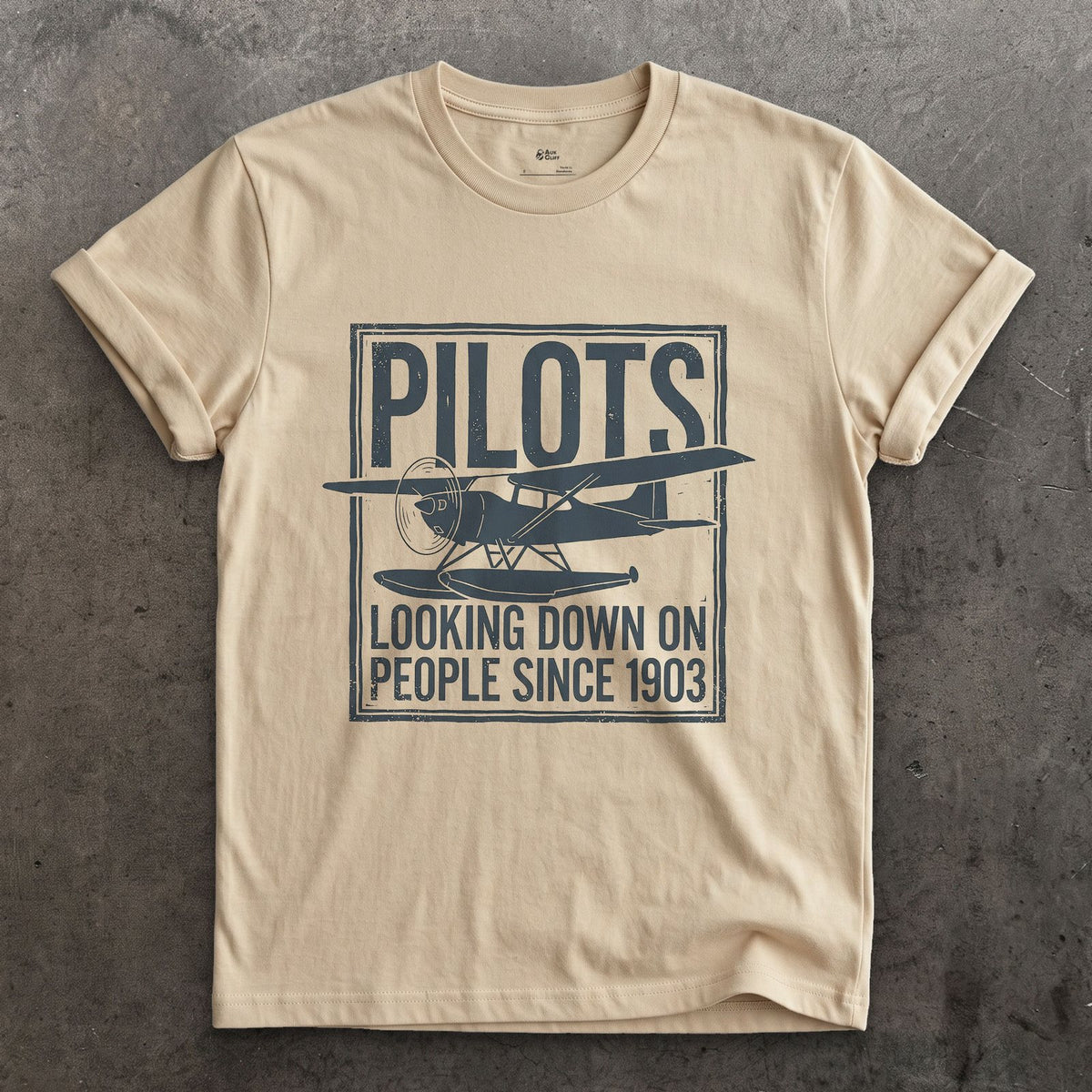 Pilots Looking Down Since 1903 design on a Sand Gildan Softstyle t-shirt