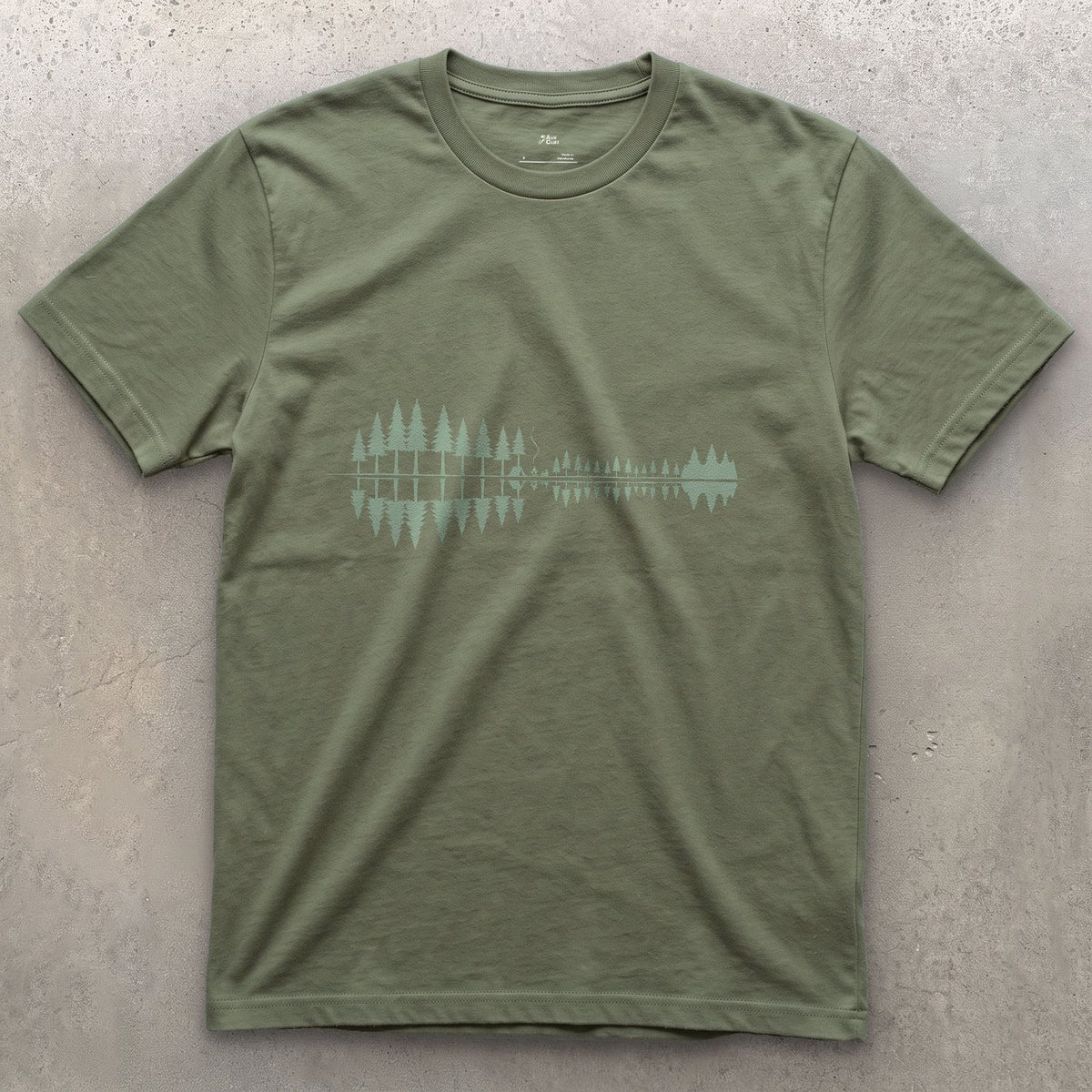 Something Passing Through the Pines design on a Military Green Gildan Softstyle t-shirt