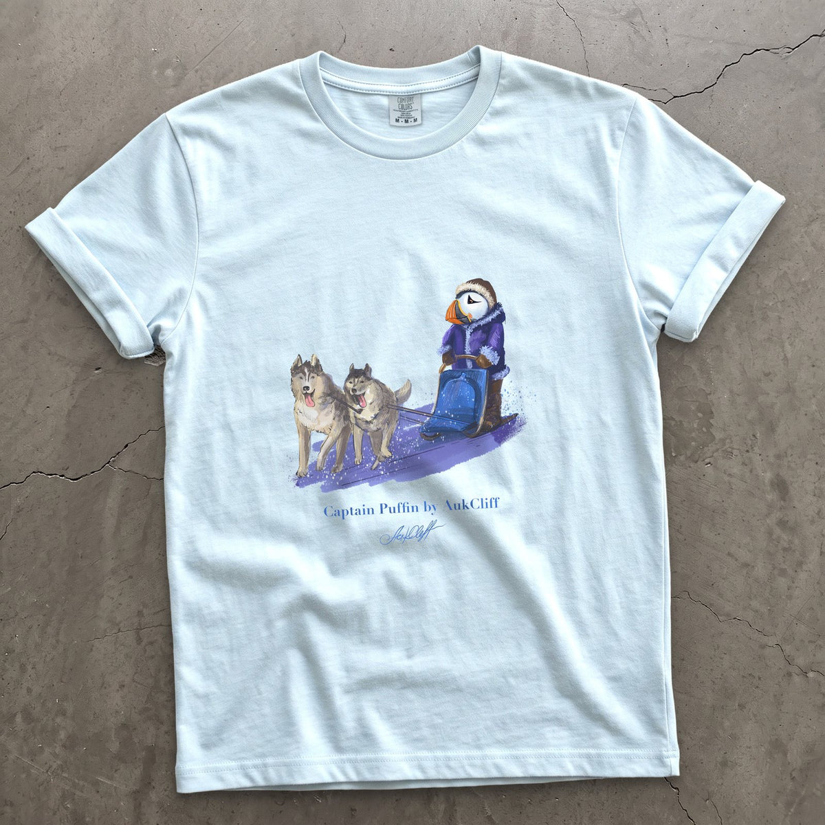 Captain Puffin Arctic Dog Sledder on a Chambray Comfort Colors t-shirt