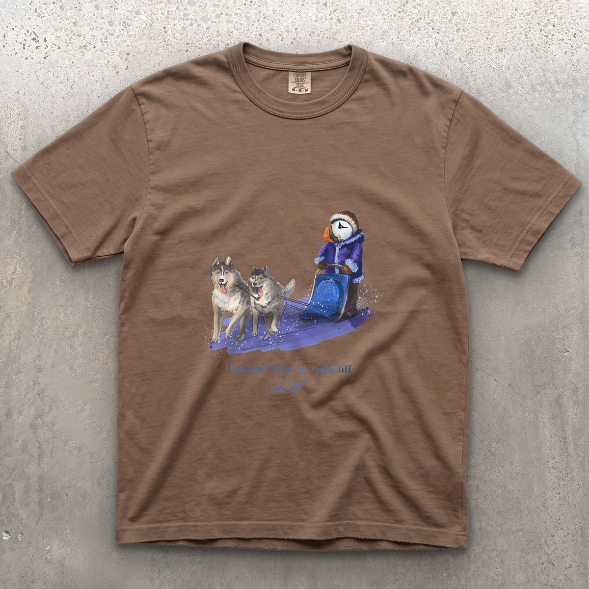 Captain Puffin Arctic Dog Sledder on a Espresso Comfort Colors t-shirt