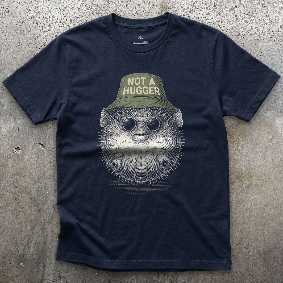 Not a Hugger, Reef Pufferfish in a Bucket Hat design on a Navy Gildan Softstyle t-shirt