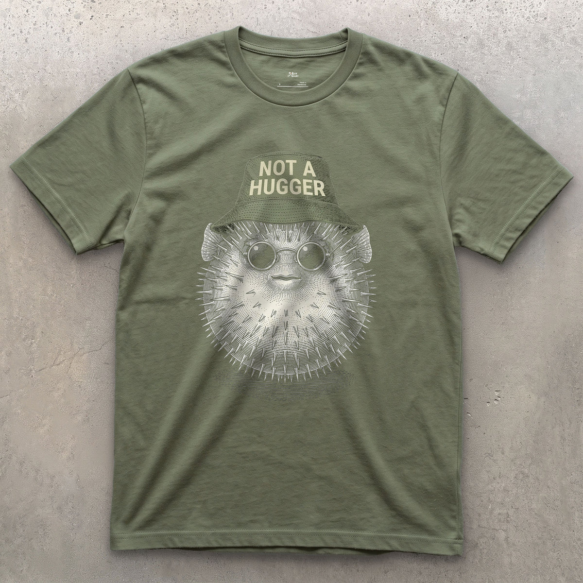 Not a Hugger, Reef Pufferfish in a Bucket Hat design on a Military Green Gildan Softstyle t-shirt
