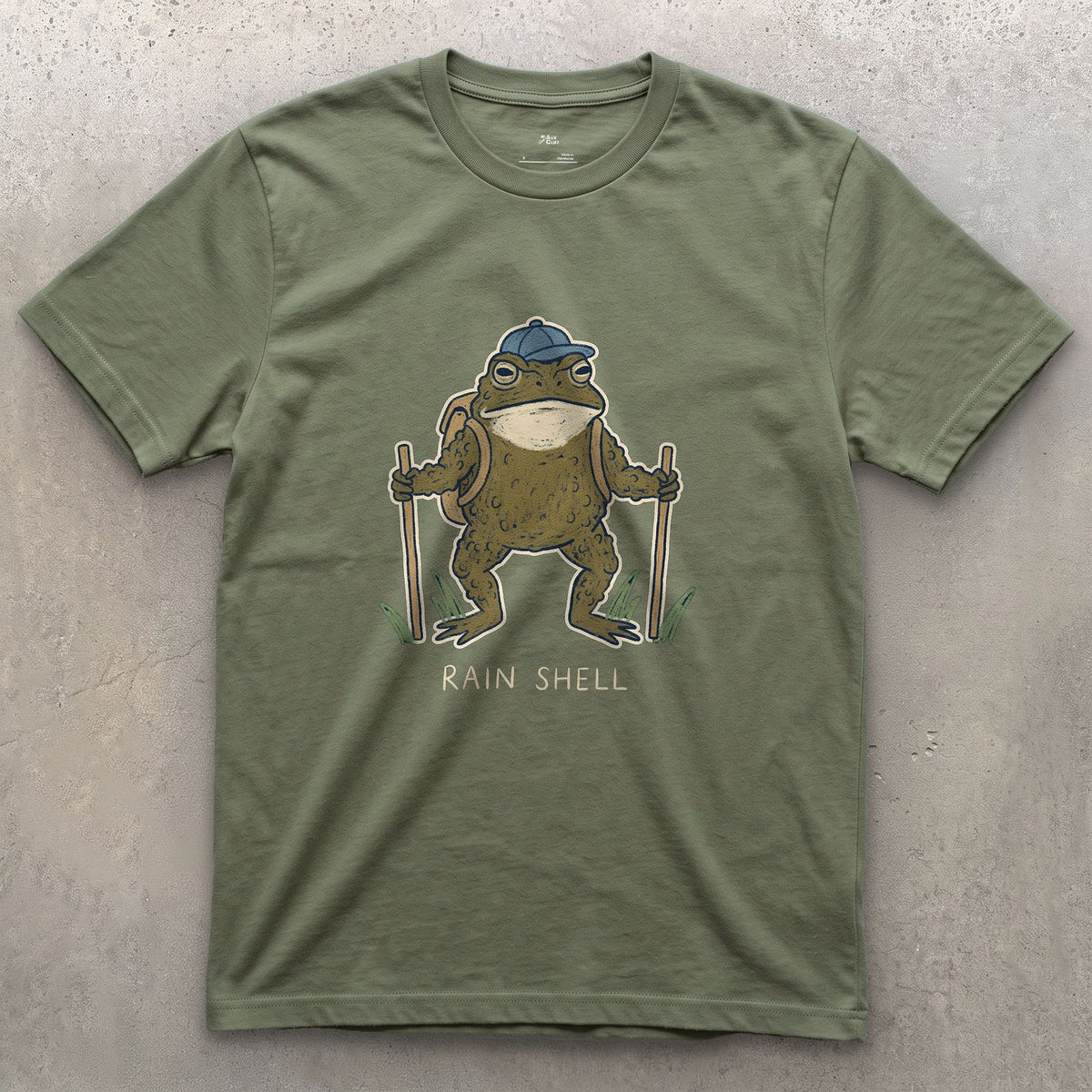 Rain Shell, Toad Hiker design on a Military Green Gildan Softstyle t-shirt
