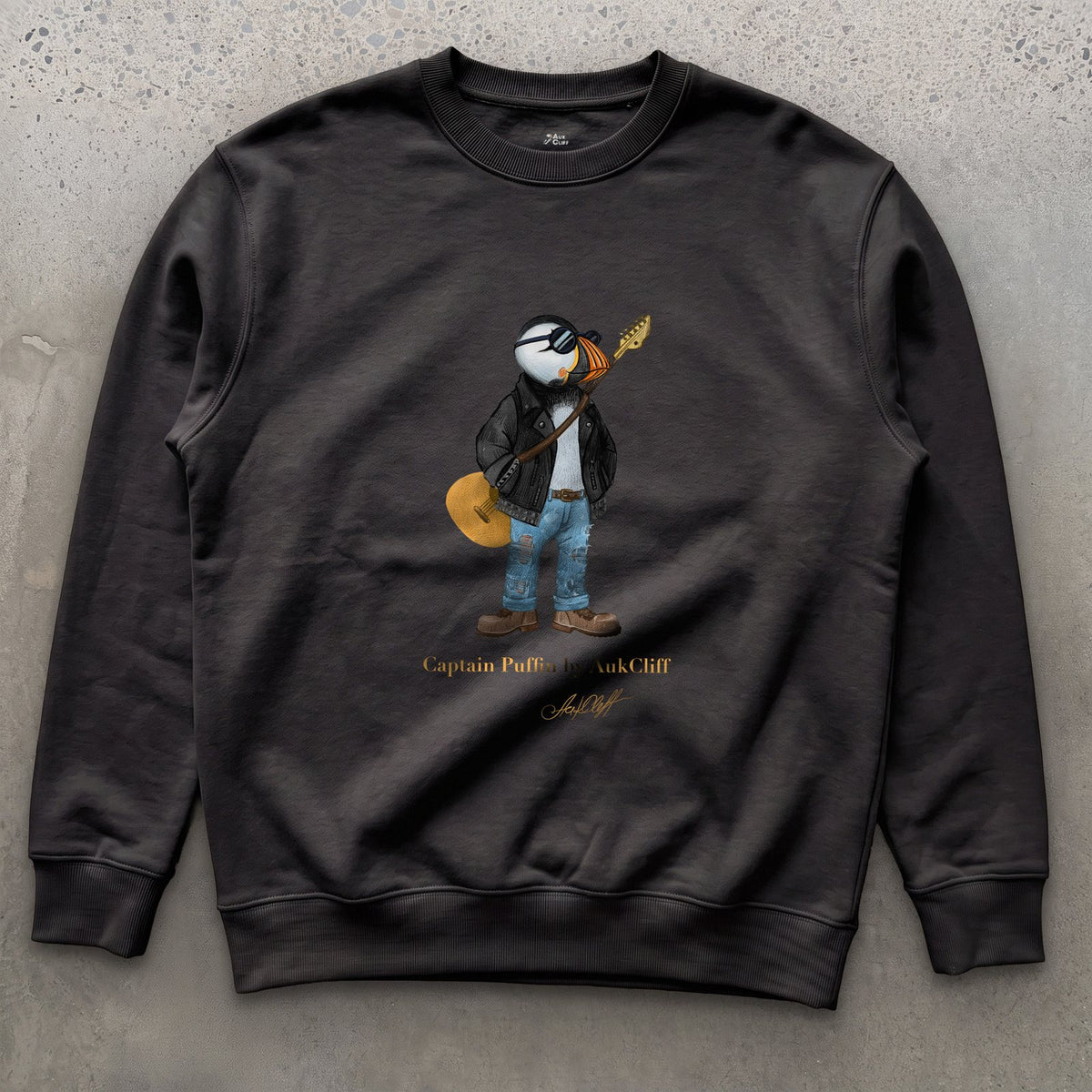 Captain Puffin The Rock Band Rebel on a Black Cotton Heritage sweatshirt