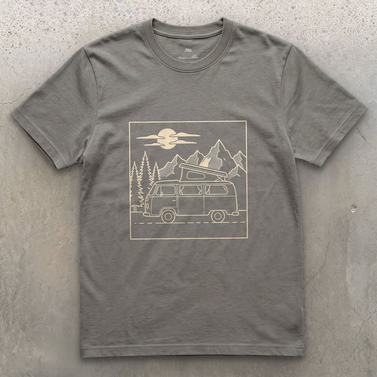 Roof Popped Under Pines and a Rising Moon design on a Charcoal Gildan Softstyle t-shirt