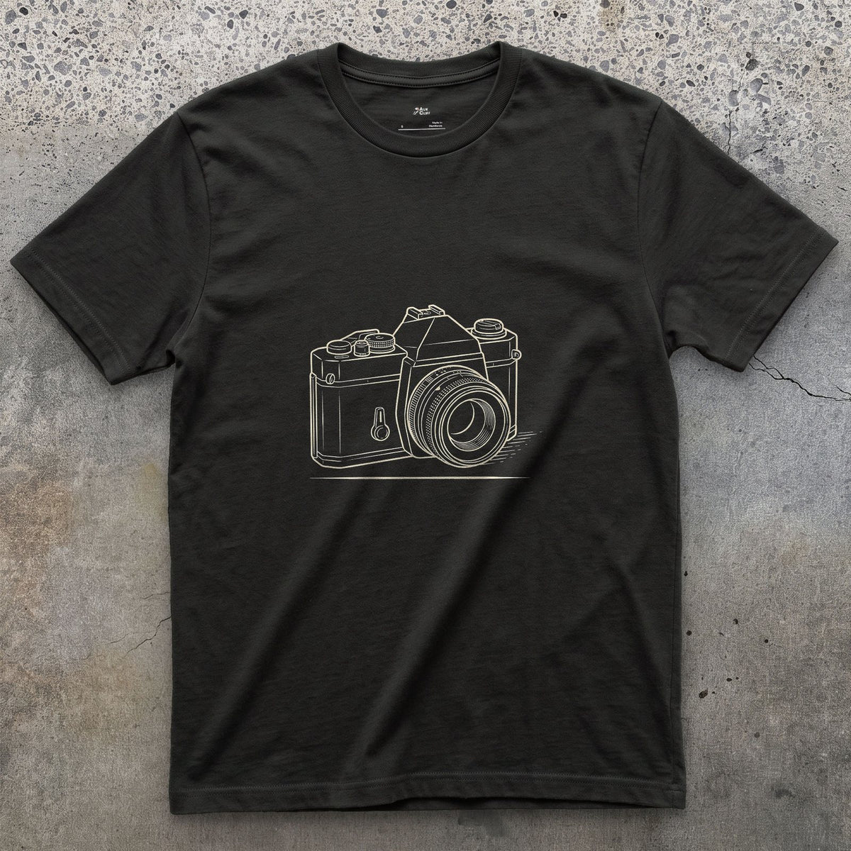 Still the Camera Shape Everyone Pictures First design on a Black Gildan Softstyle t-shirt
