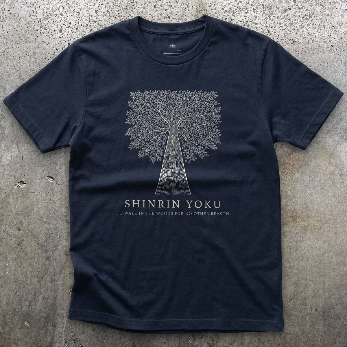 Shinrin Yoku, to Walk in the Woods for No Other Reason design on a Navy Gildan Softstyle t-shirt