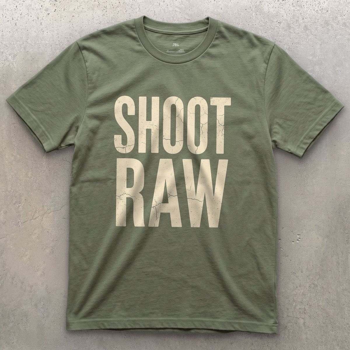 Shoot Raw, the Only Camera Setting design on a Military Green Gildan Softstyle t-shirt