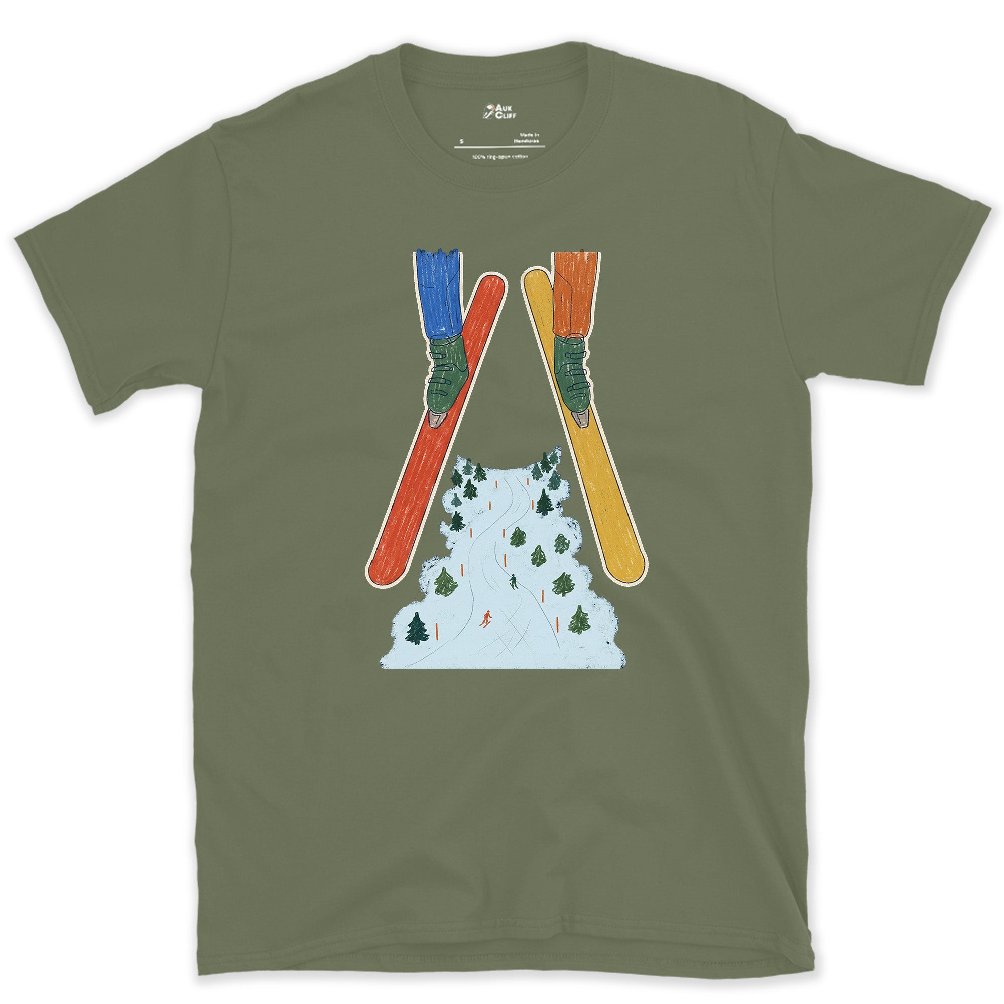 Crossed Skis Frame the Piste Beyond design on a Military Green Gildan Softstyle t-shirt