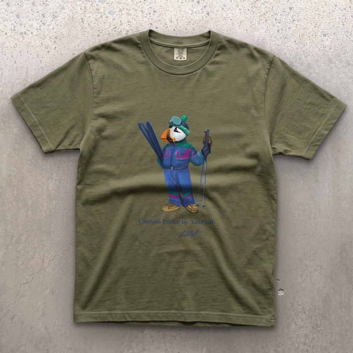 Captain Puffin Retro Ski on a Moss Comfort Colors t-shirt