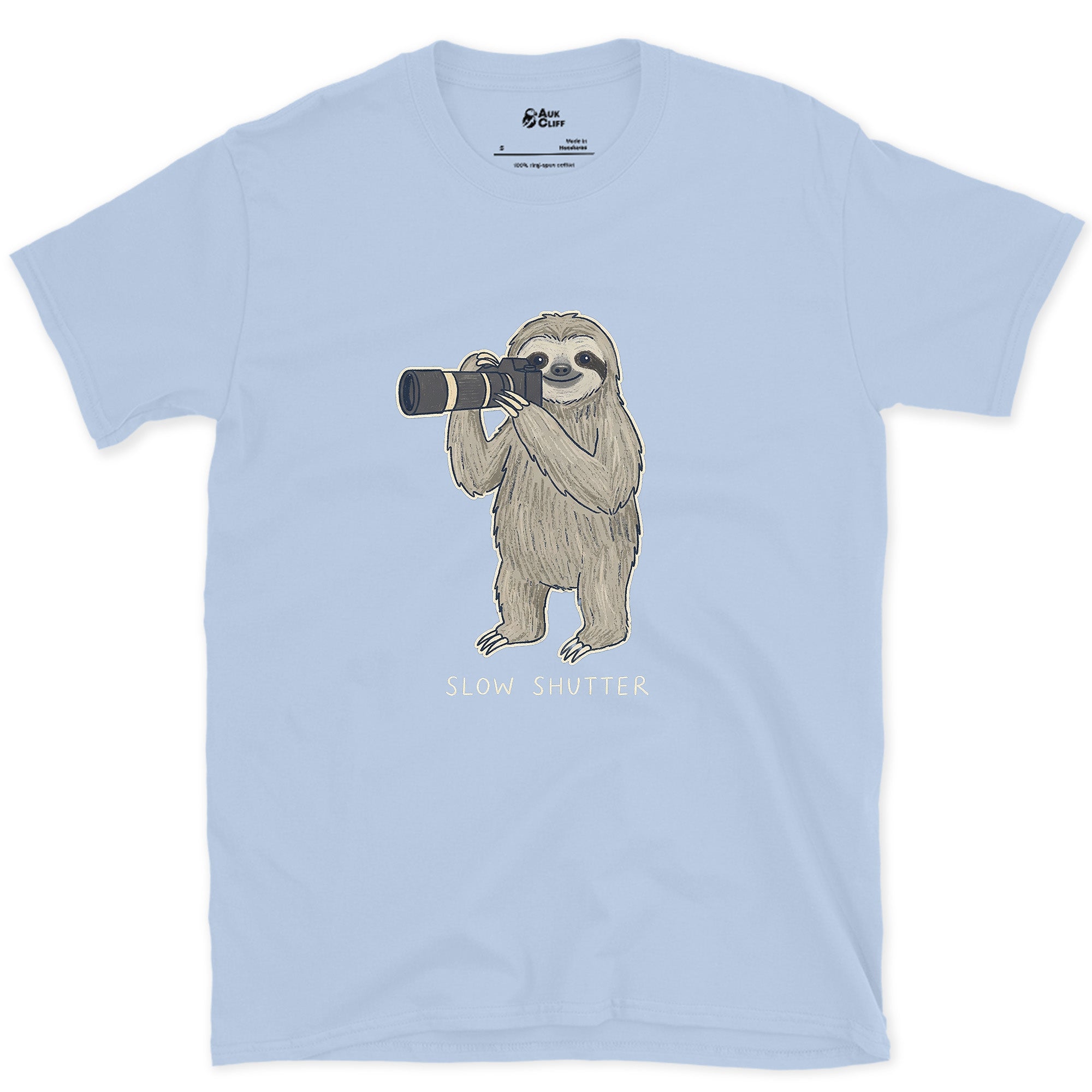 Slow Shutter, Sloth Never Rushes Anyway design on a Light Blue Gildan Softstyle t-shirt