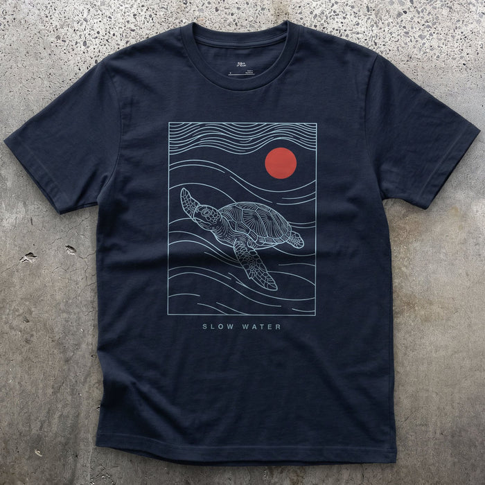 Slow Water, Sea Turtle design on a Navy Gildan Softstyle t-shirt