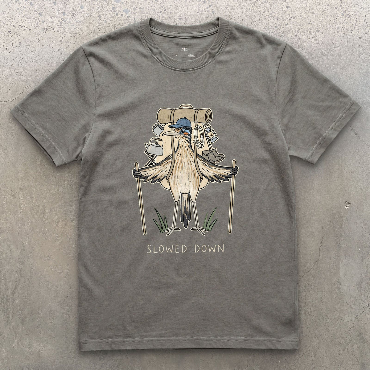 Slowed Down, Roadrunner Hiker design on a Charcoal Gildan Softstyle t-shirt
