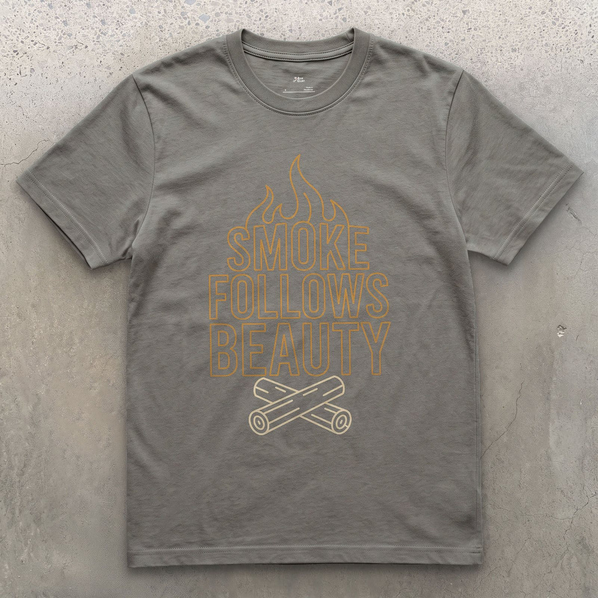 The Smoke Always Finds the Pretty One design on a Charcoal Gildan Softstyle t-shirt