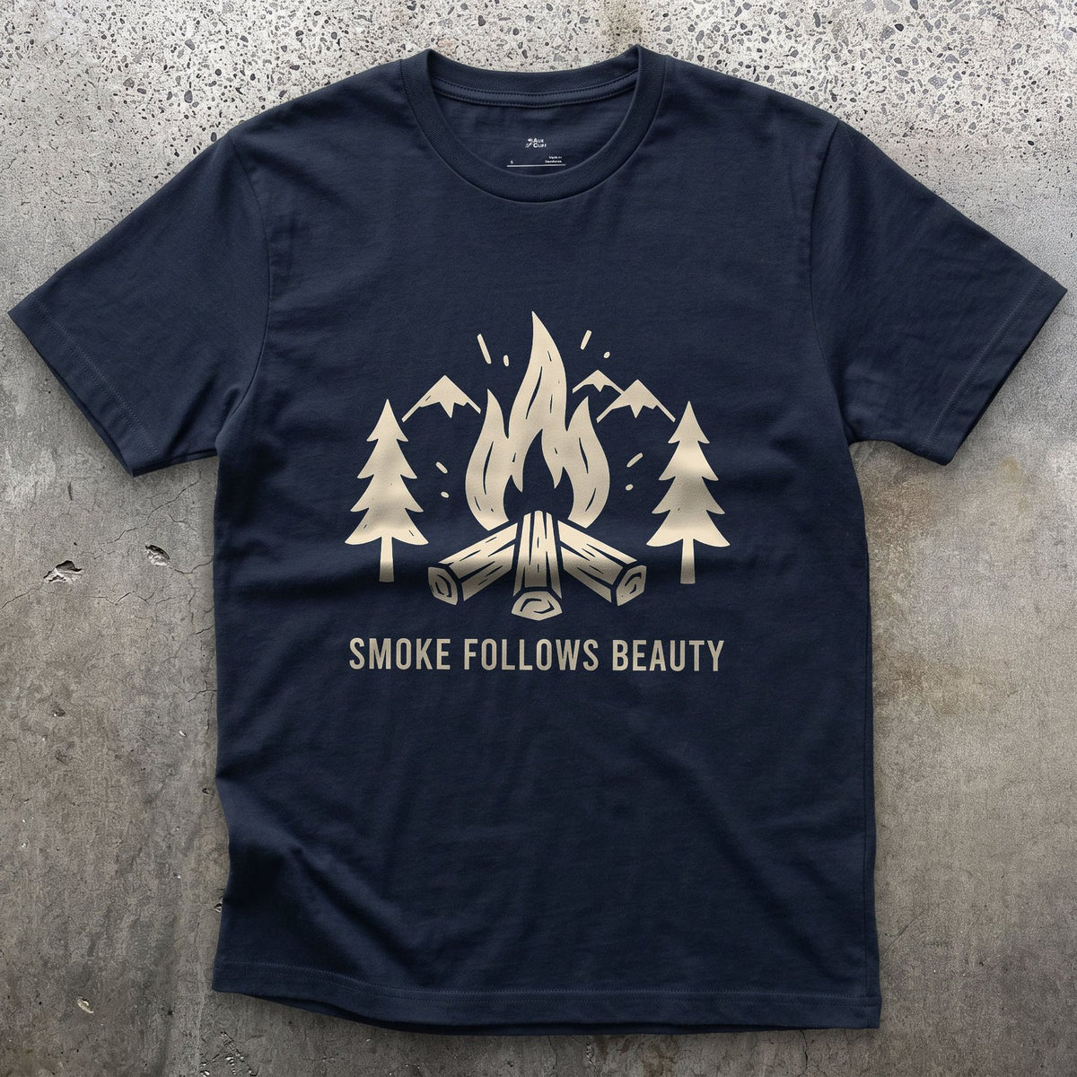 The Smoke Follows Beauty, Mountains and Firewood design on a Navy Gildan Softstyle t-shirt