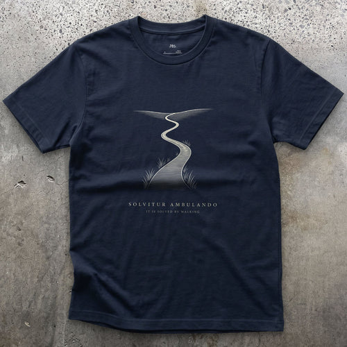 Solvitur Ambulando, It Is Solved by Walking design on a Navy Gildan Softstyle t-shirt