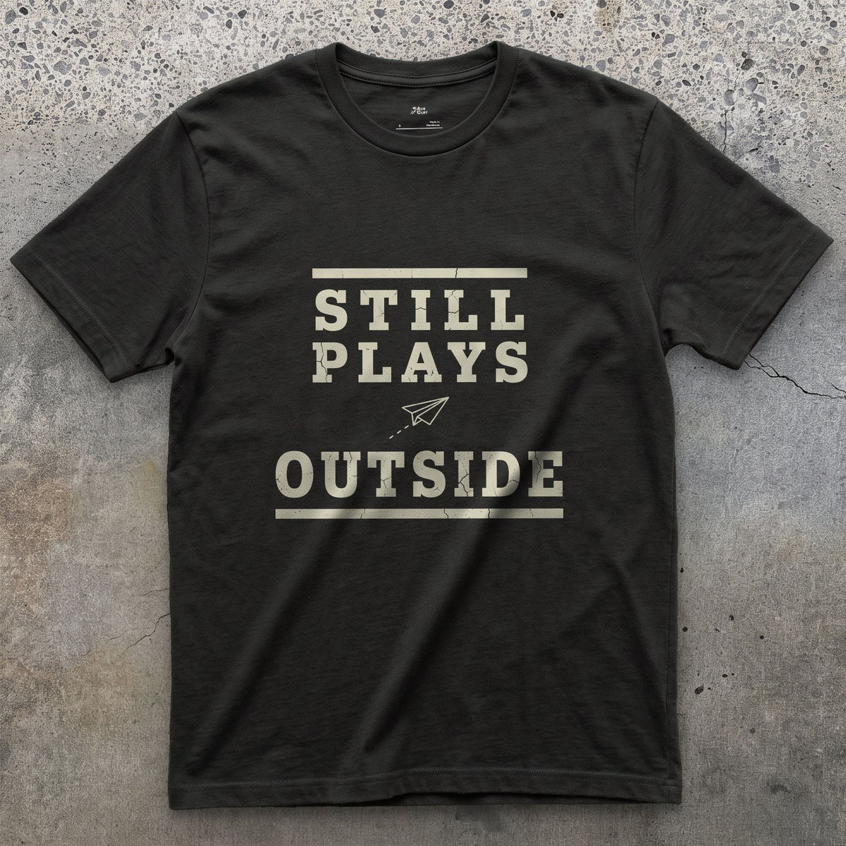 Still Plays Outside, Paper Airplane and All design on a Black Gildan Softstyle t-shirt