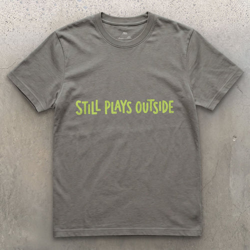 Spring Green, Still Plays Outside on the Mountain design on a Charcoal Gildan Softstyle t-shirt